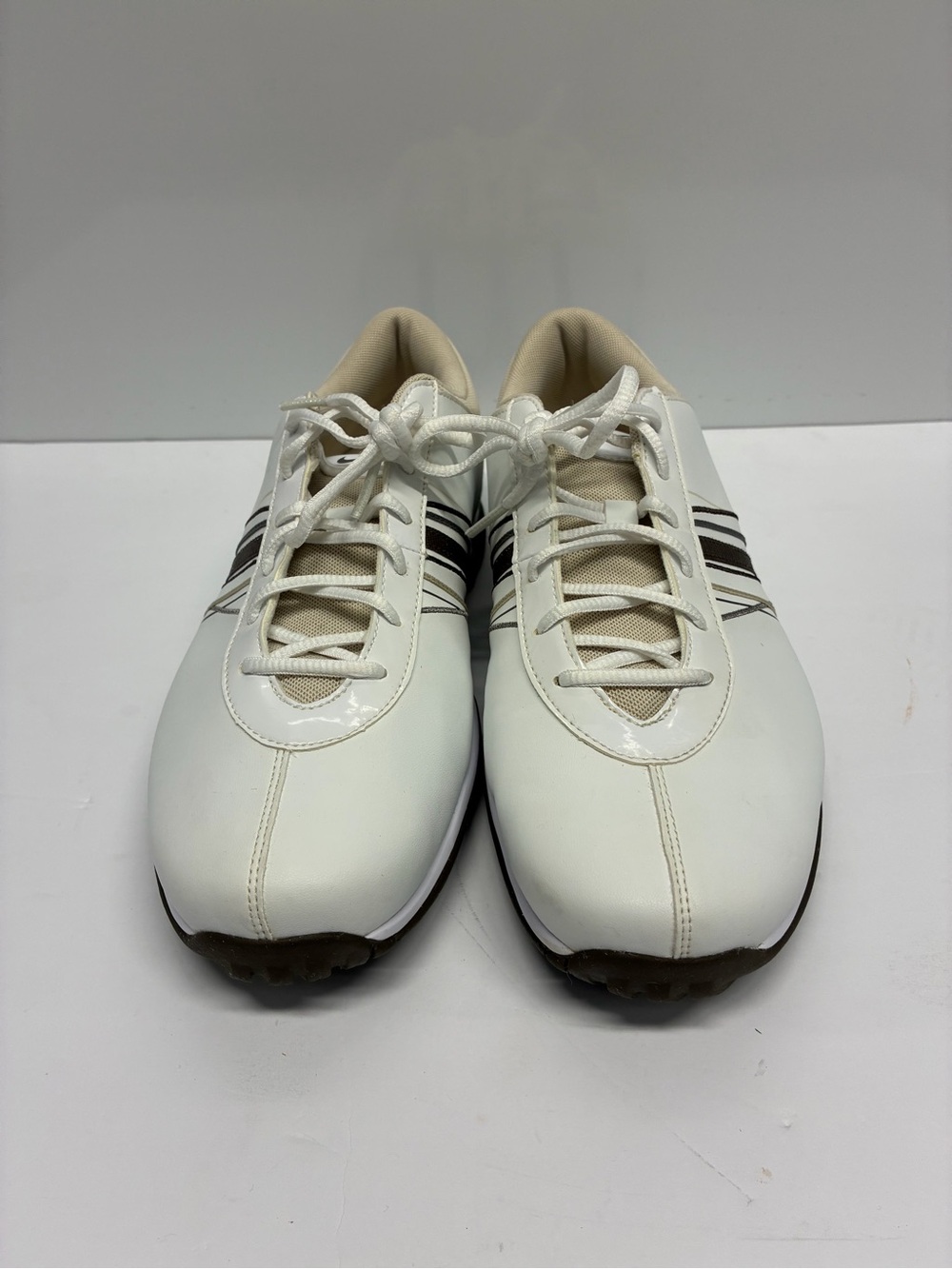 Nike White Athletic Shoes with Black Stripes